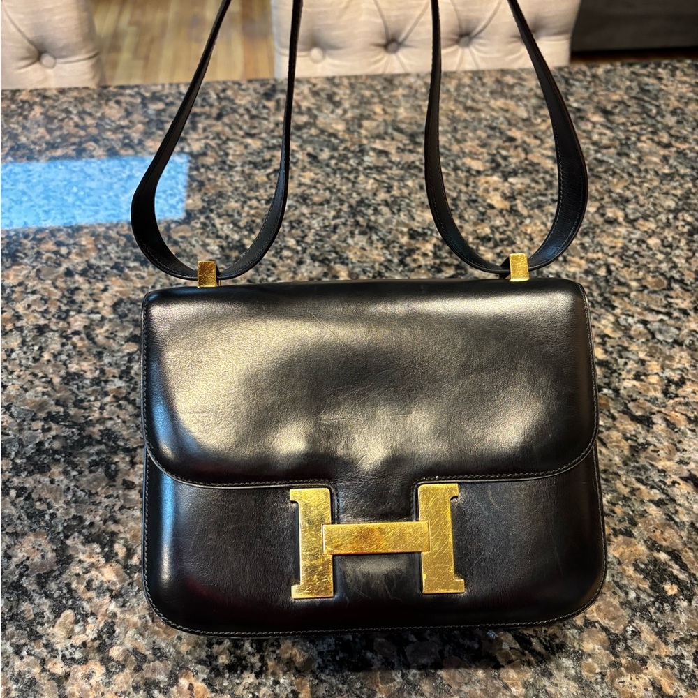 Black Hermes Leather Bag with Gold Accents